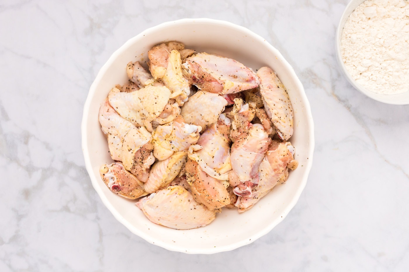 seasoned chicken wings in a bowl