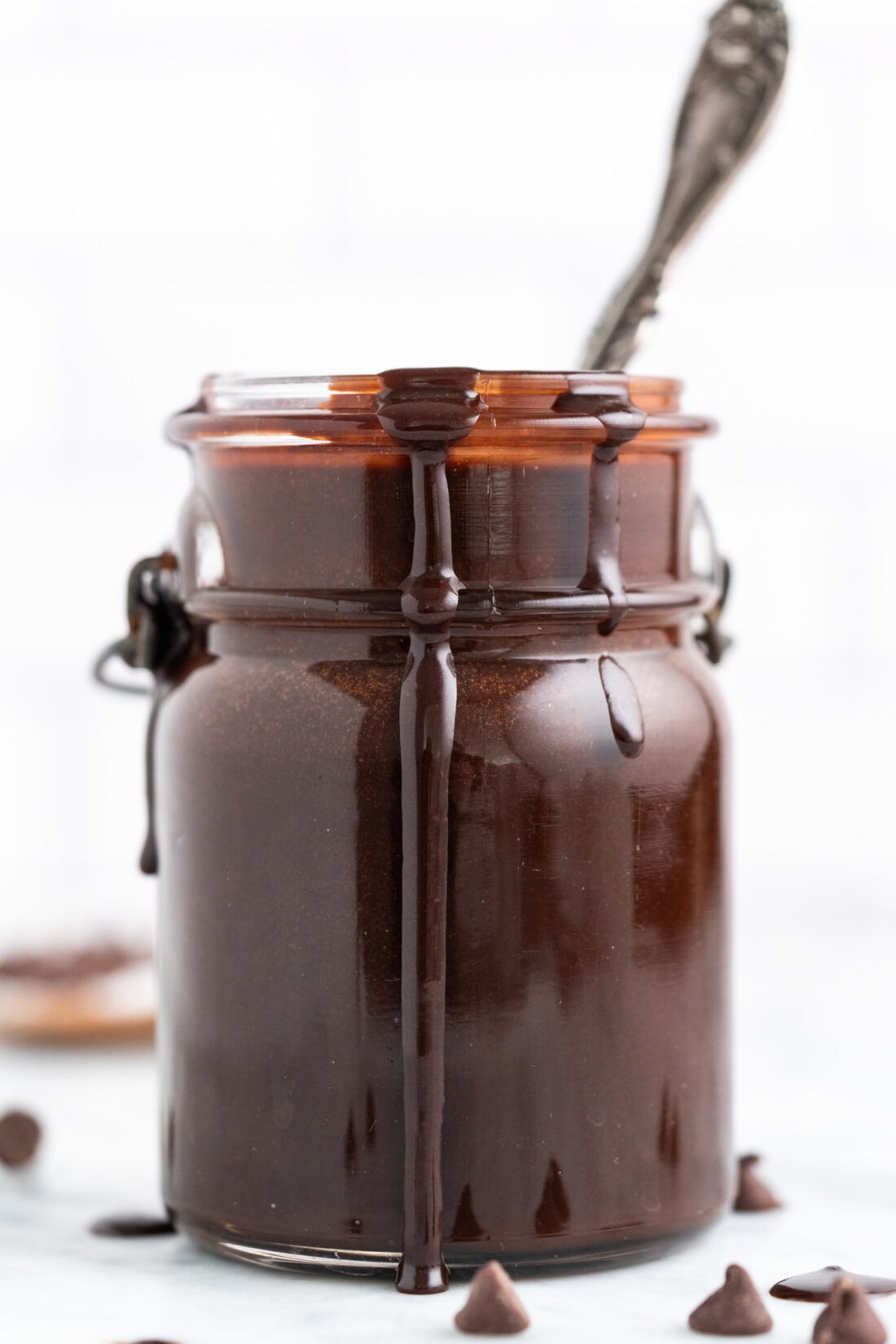 Hot Fudge in a jar with a spoon