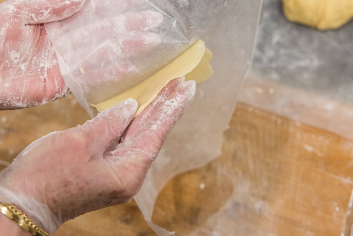 removing pie dough disc from parchment paper