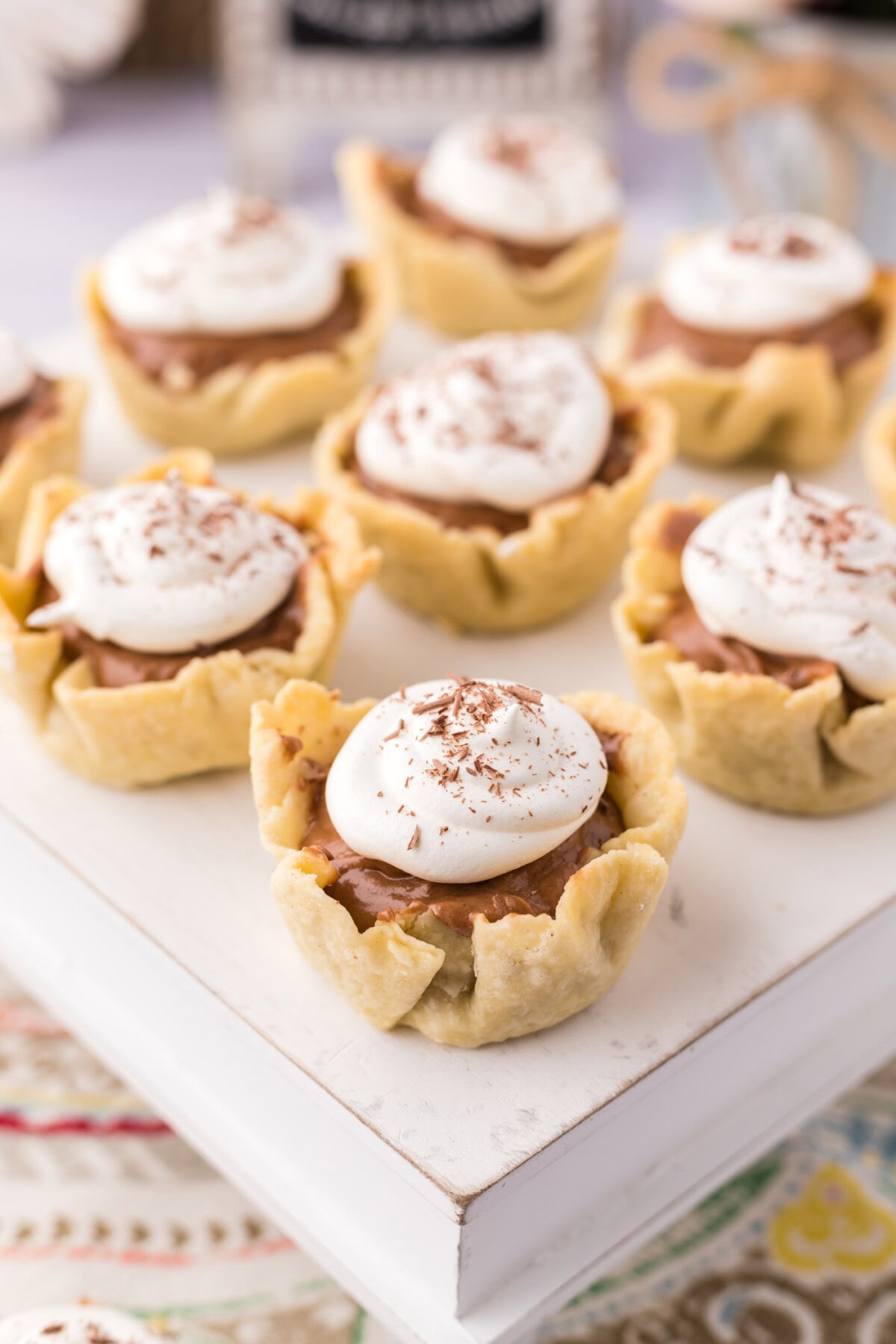 Mini French Silk Pies on a cake stand