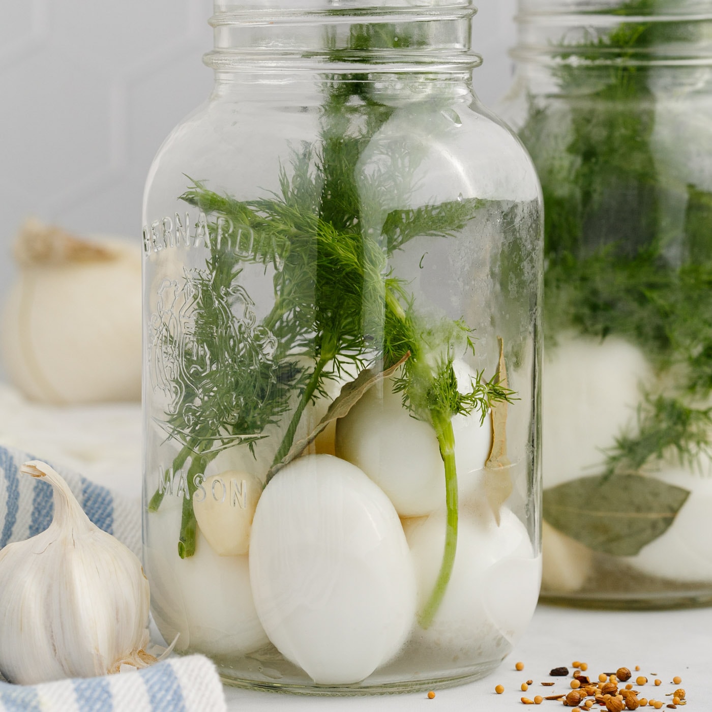 hard boiled eggs and fresh herbs in a mason jar