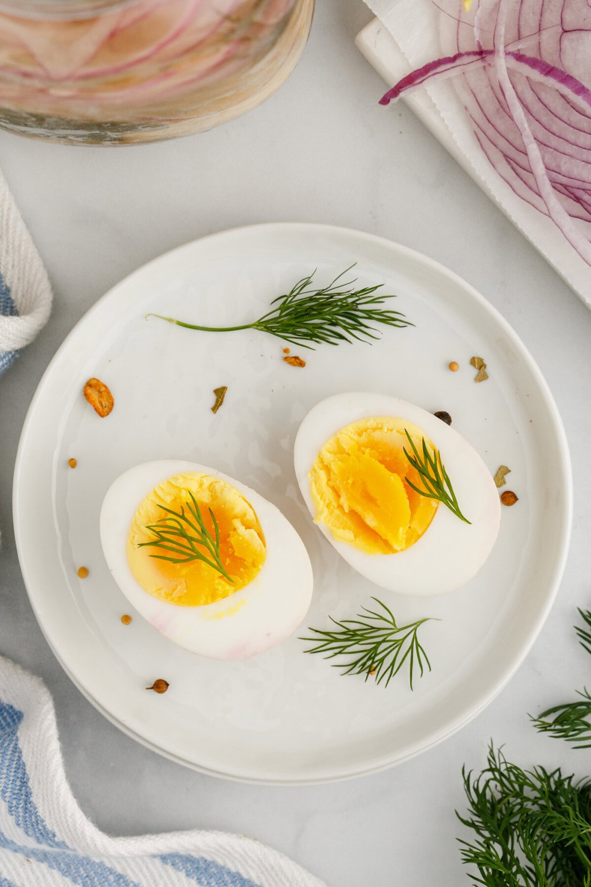 A Pickled Egg cut in half on a plate