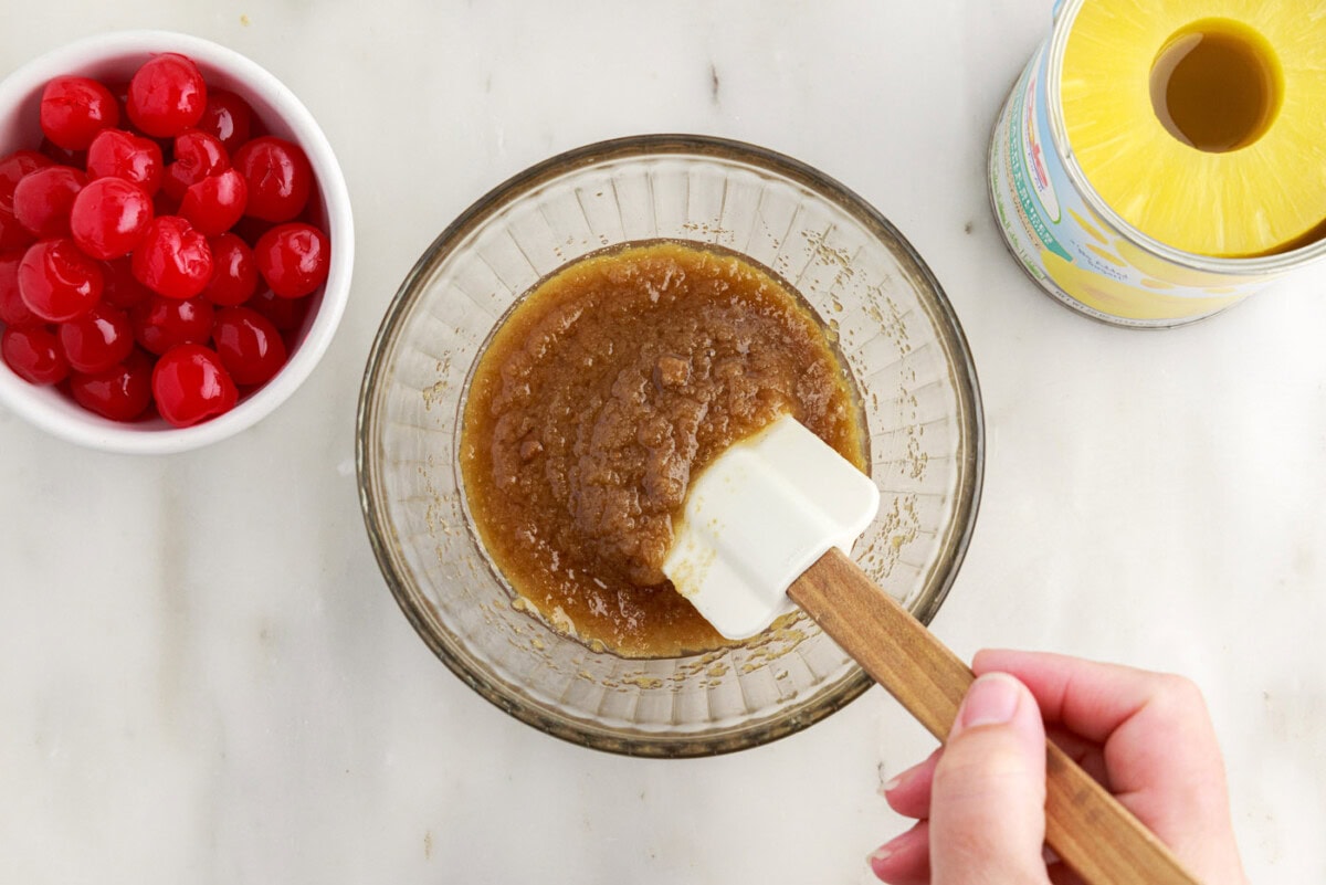 mixing brown sugar and butter in a bowl