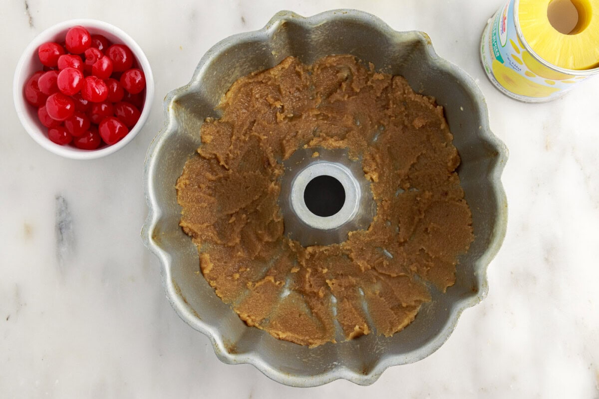 brown sugar mixture spread out in bundt pan