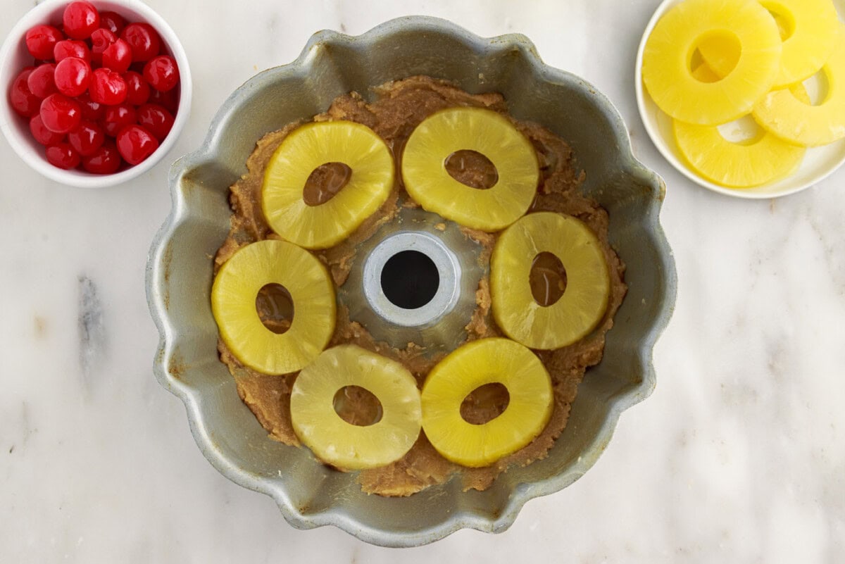 pineapple rings on top of brown sugar mixture