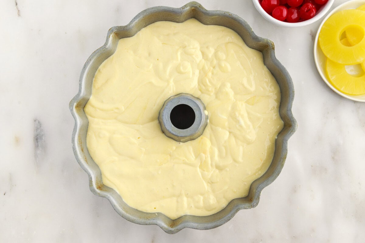 pineapple bundt cake batter in a pan