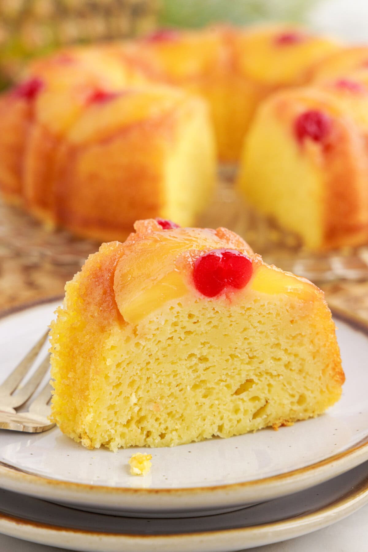 Slice of Pineapple Upside Down Bundt Cake on a plate