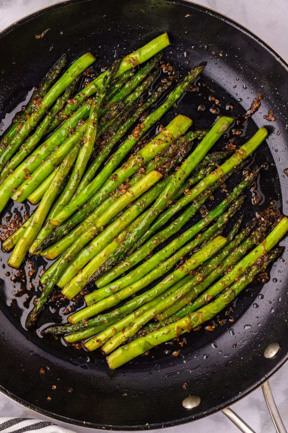 Close up photo of Sautéed Asparagus in a skillet