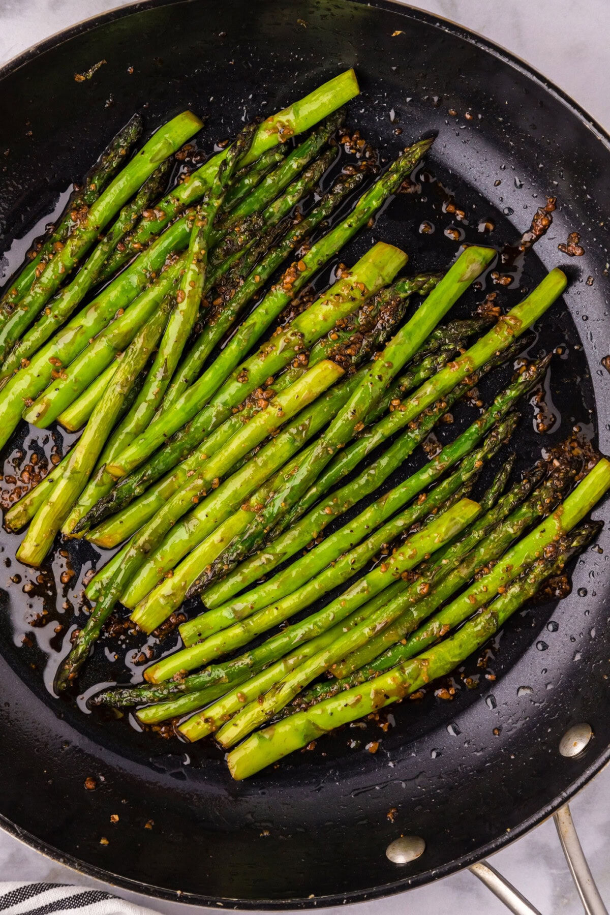 Close up photo of Sautéed Asparagus in a skillet