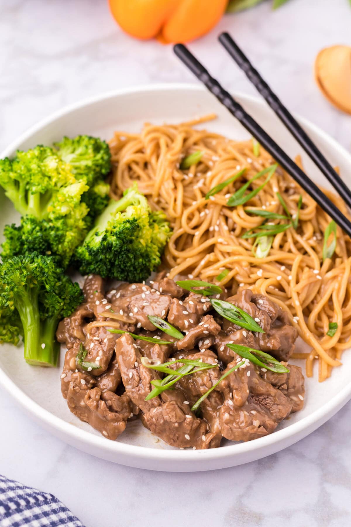 Beef Teriyaki served with broccoli and teriyaki noodles