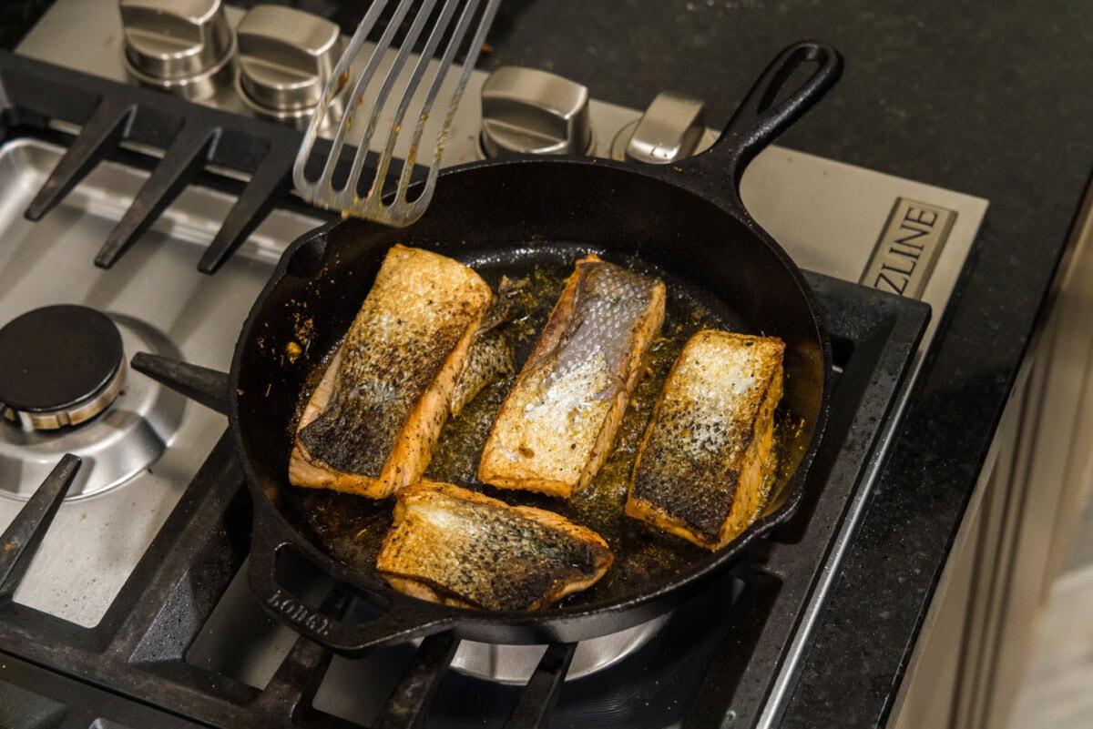 salmon skin side up in skillet
