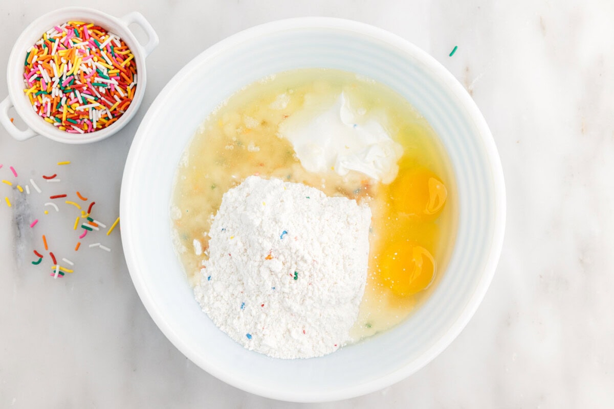 cake mix, eggs, sour cream, and oil in a mixing bowl