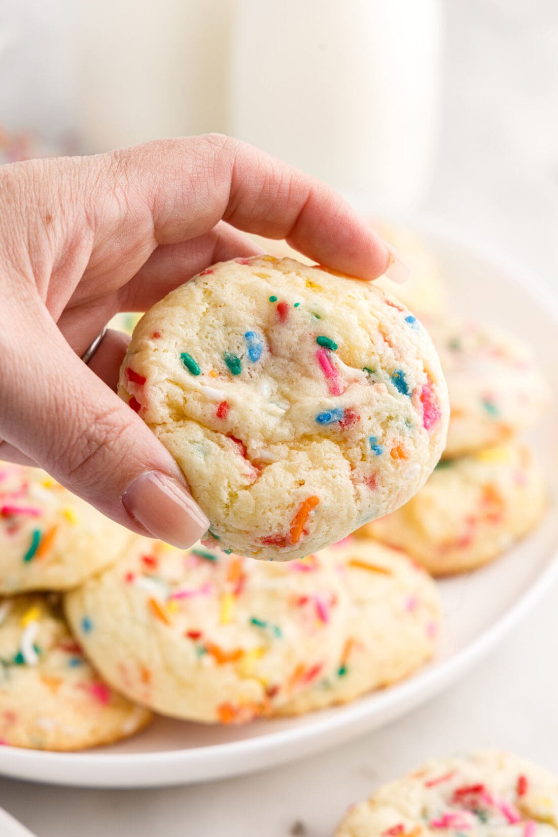 Hand holding a Funfetti Cake Mix Cookie