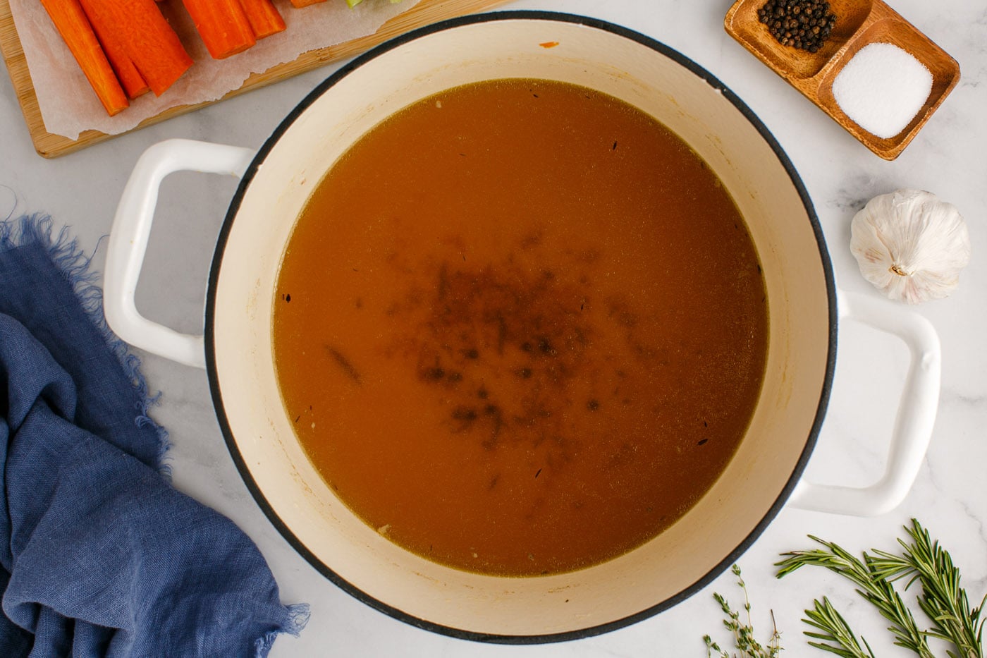 homemade chicken stock in a stockpot