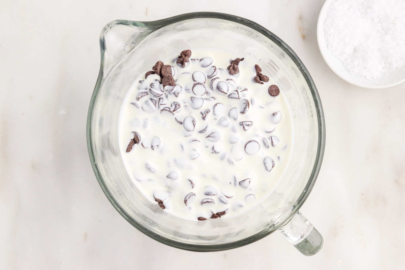 chocolate chips and cream in a bowl