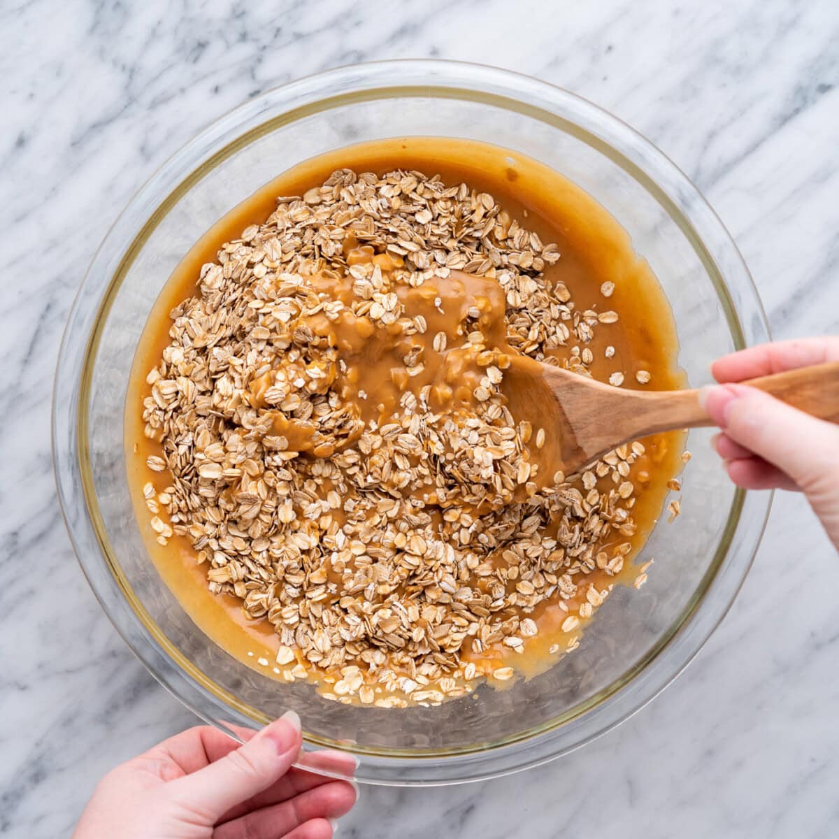 stirring oats into peanut butter mixture