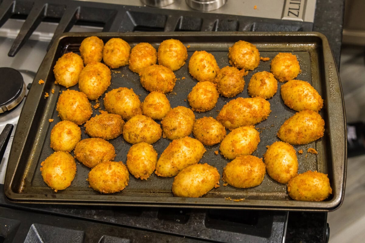 sliced potatoes cut side down on a baking sheet