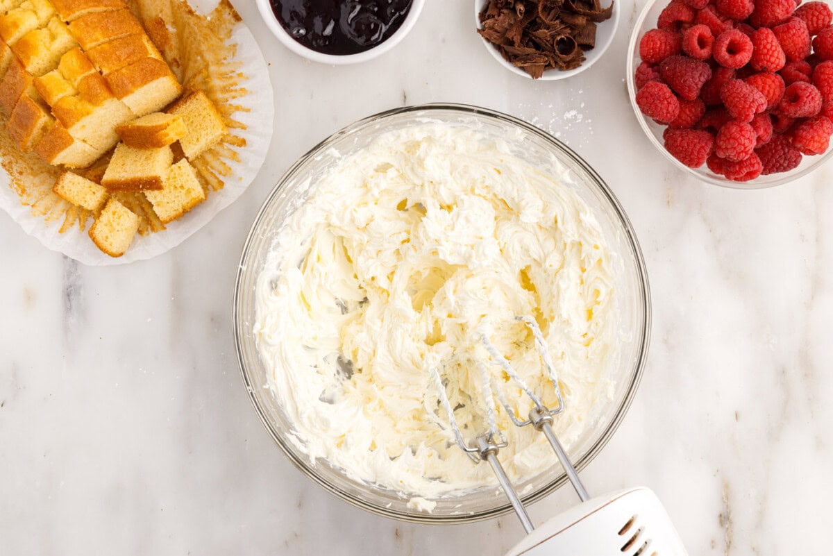 cream cheese mixture in a bowl with a mixer