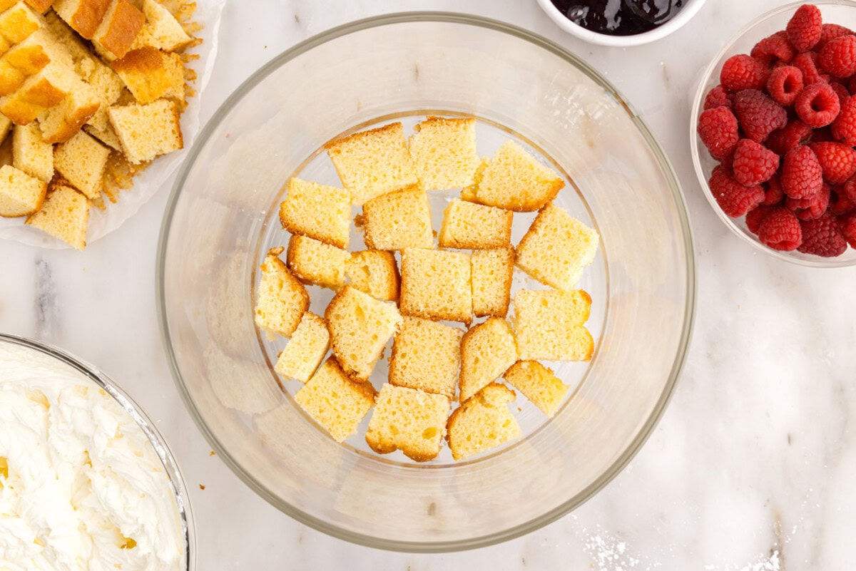 pound cake cubes on the bottom of a trifle bowl