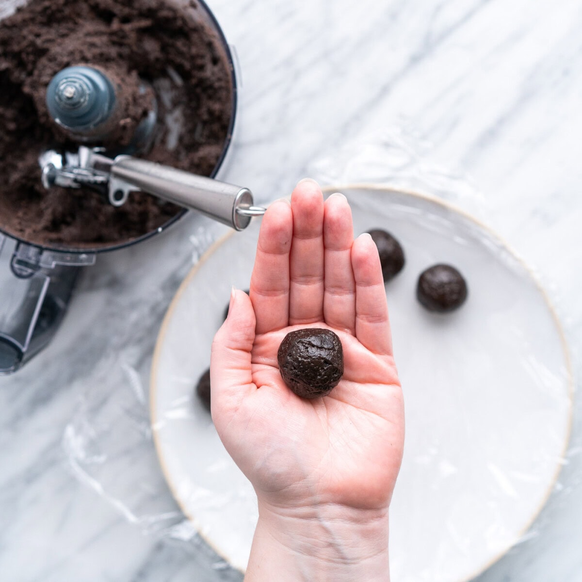 rolling oreo truffles into a ball