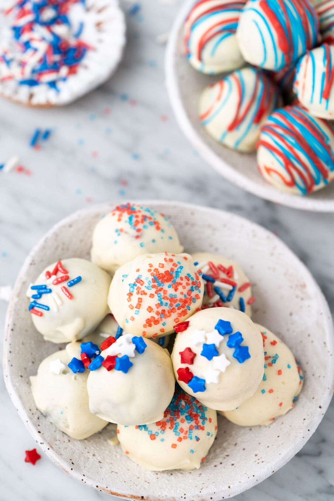 Two bowls of Red White and Blue Oreo Truffles