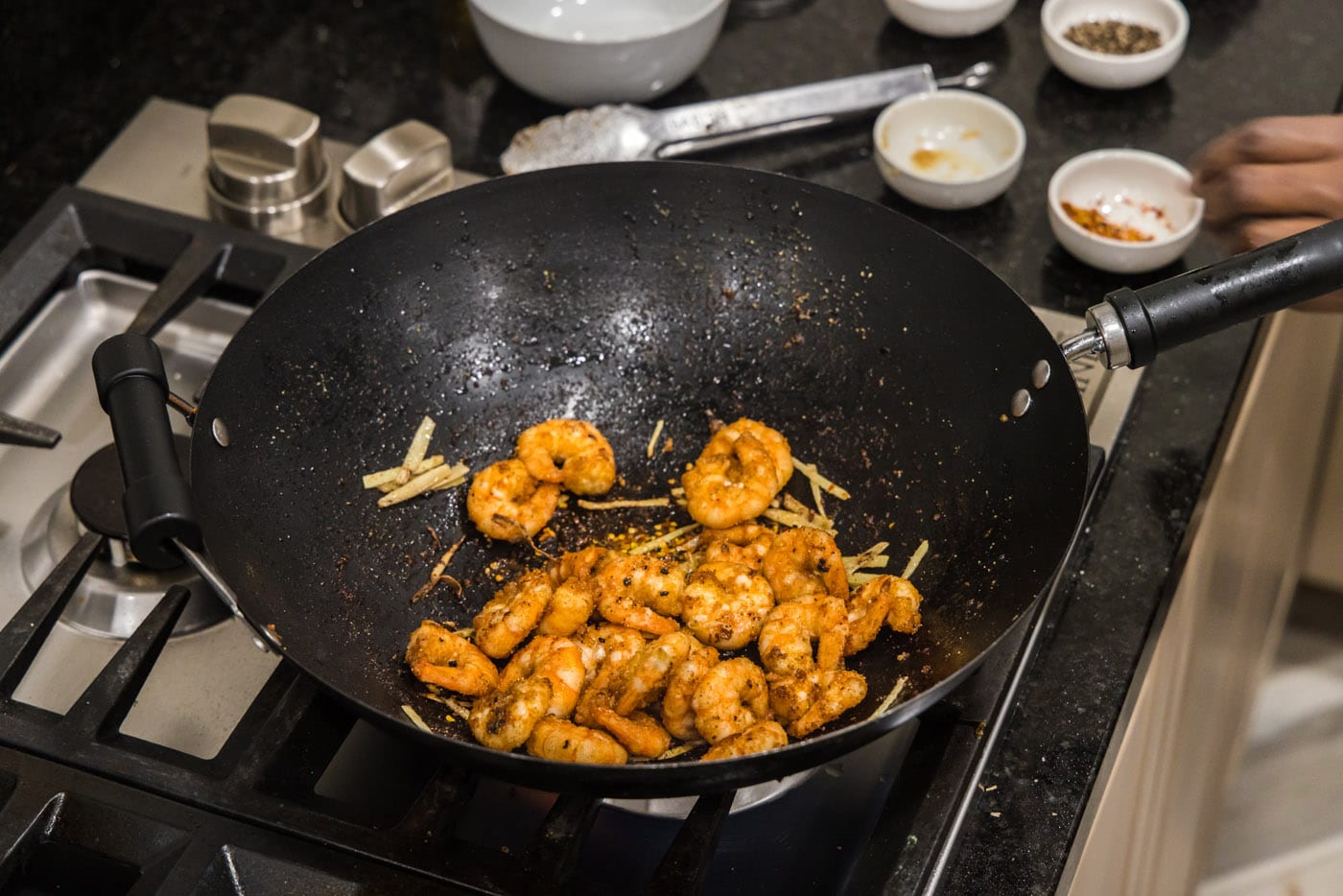 shrimp added to wok with ginger