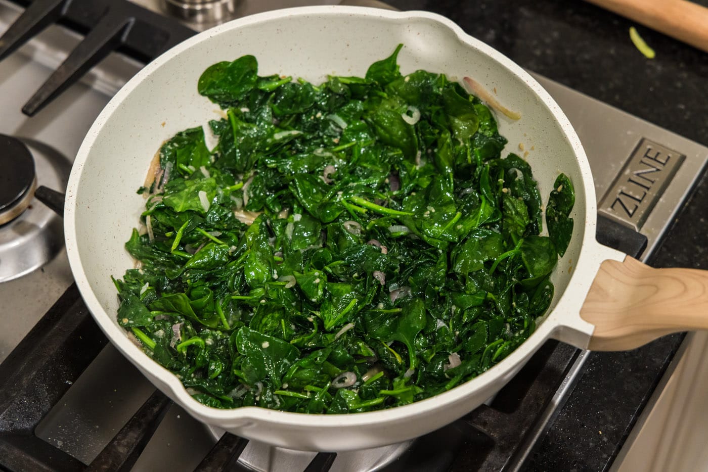 sauteed spinach in a skillet