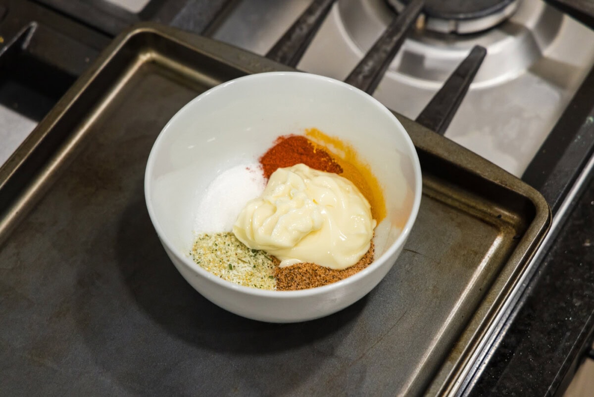 butter and cajun spices in a mixing bowl