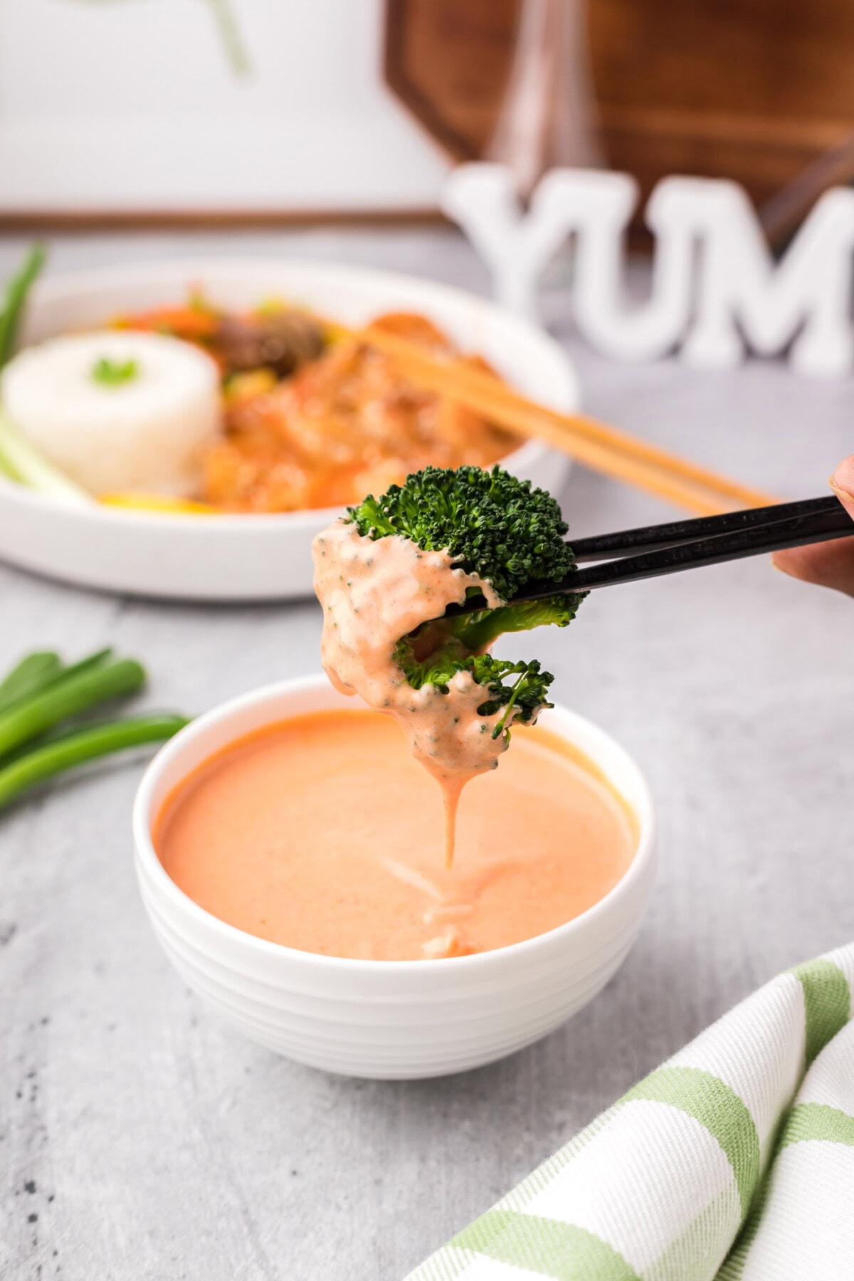 Broccoli dipped in Yum Yum Sauce