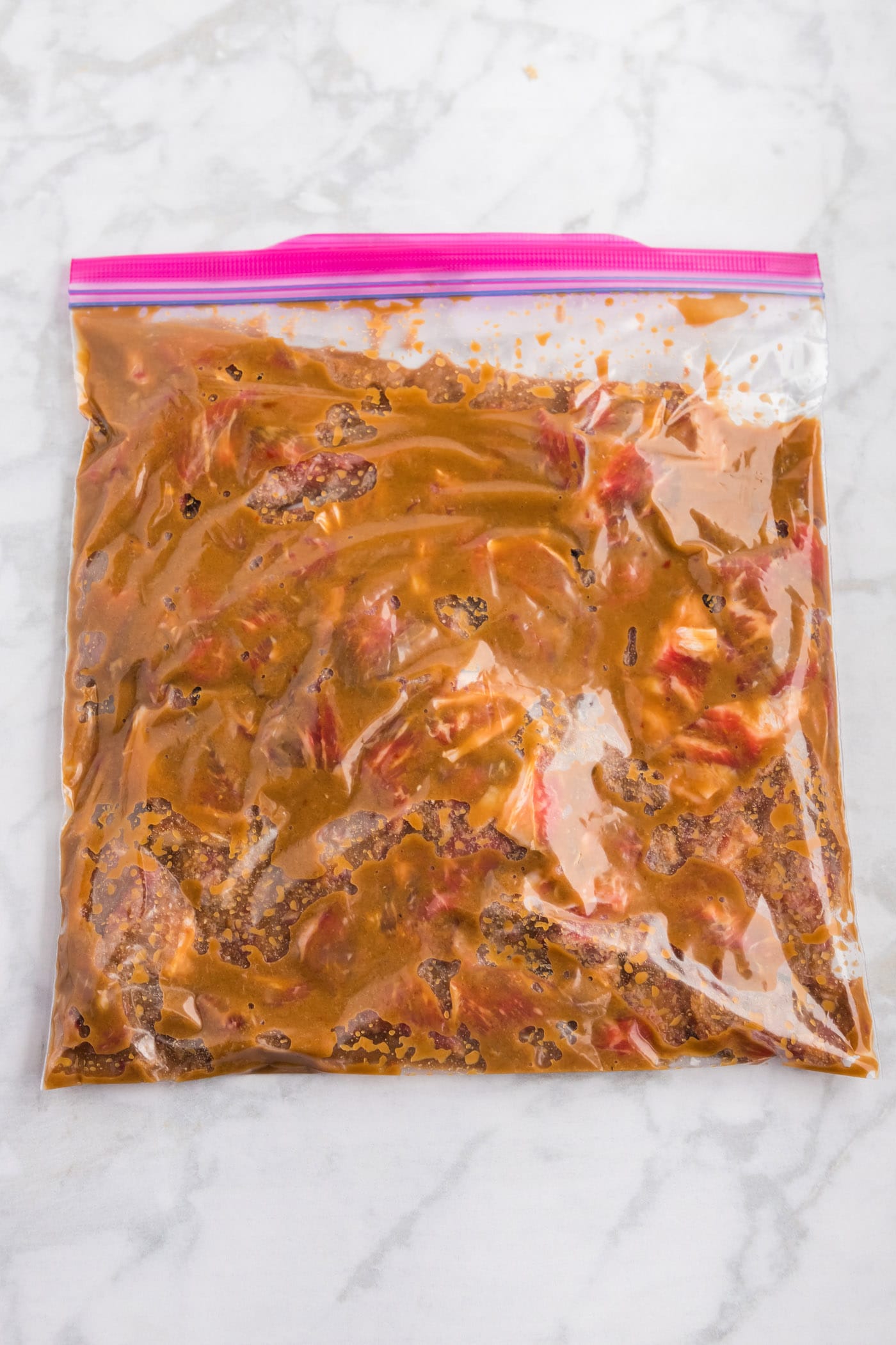 marinating ribeye steak in a large ziptop bag