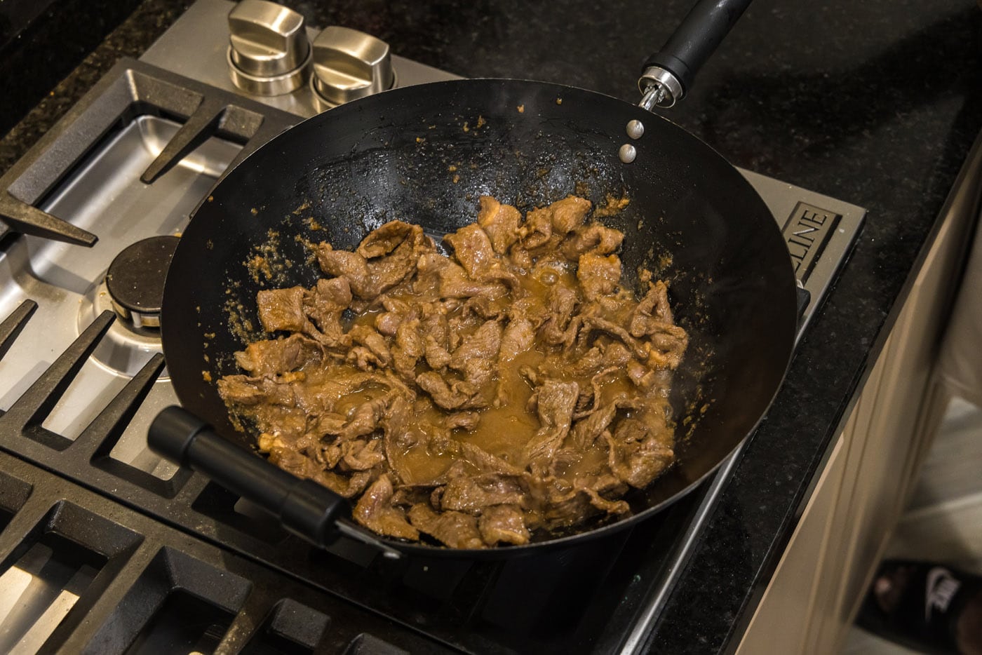 beef strips in a wok