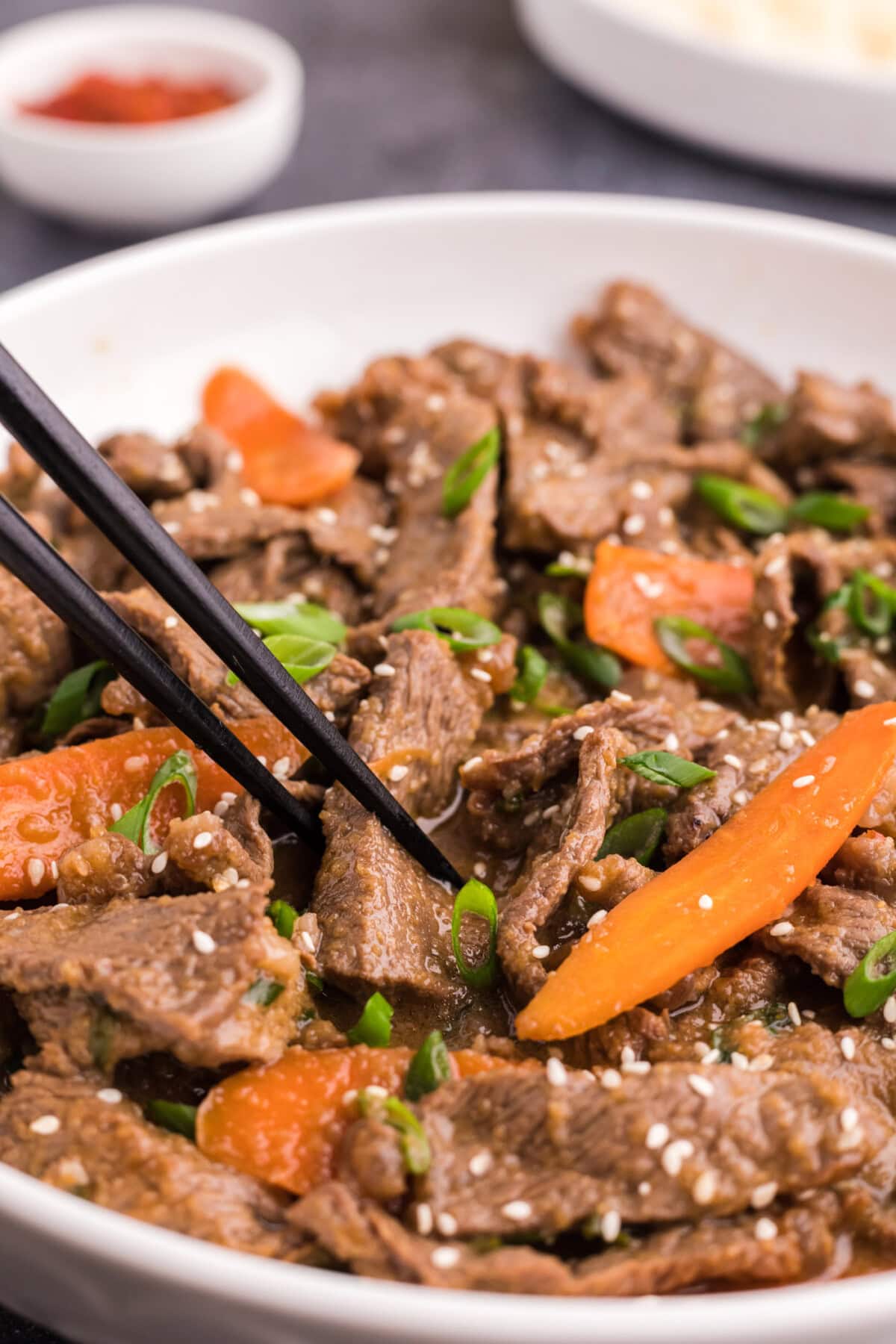 Chopsticks in a bowl of Beef Bulgogi