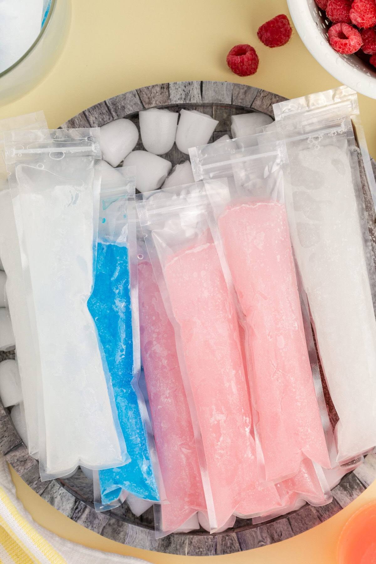 Boozy Ice Pops resting in a bowl of ice