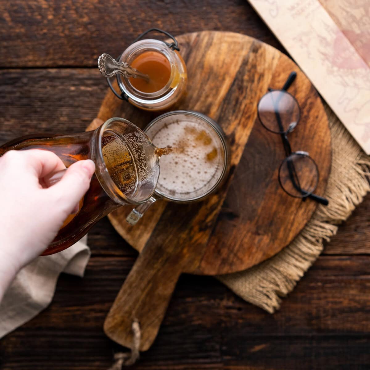 pouring cream soda into a mug