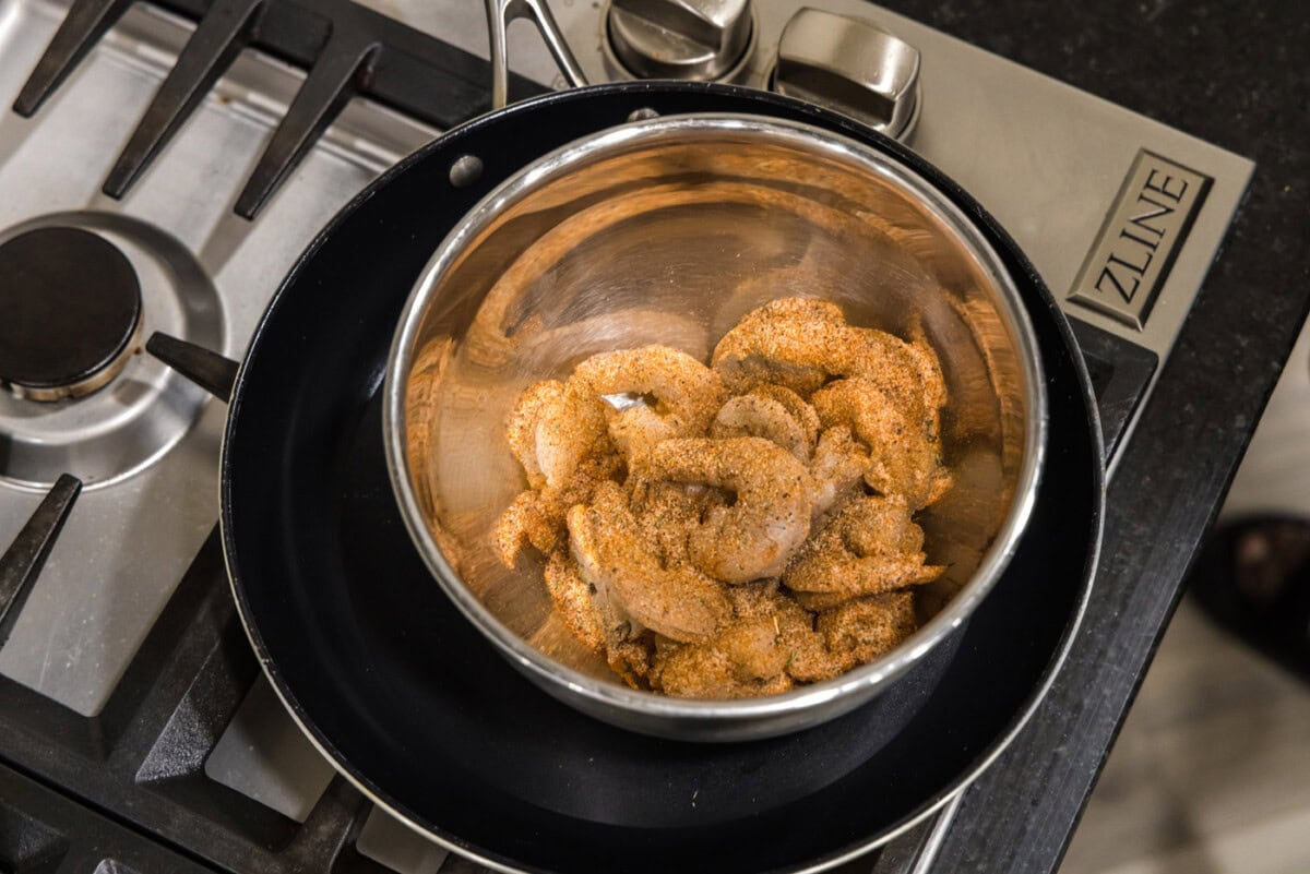 cajun seasoned shrimp in a mixing bowl
