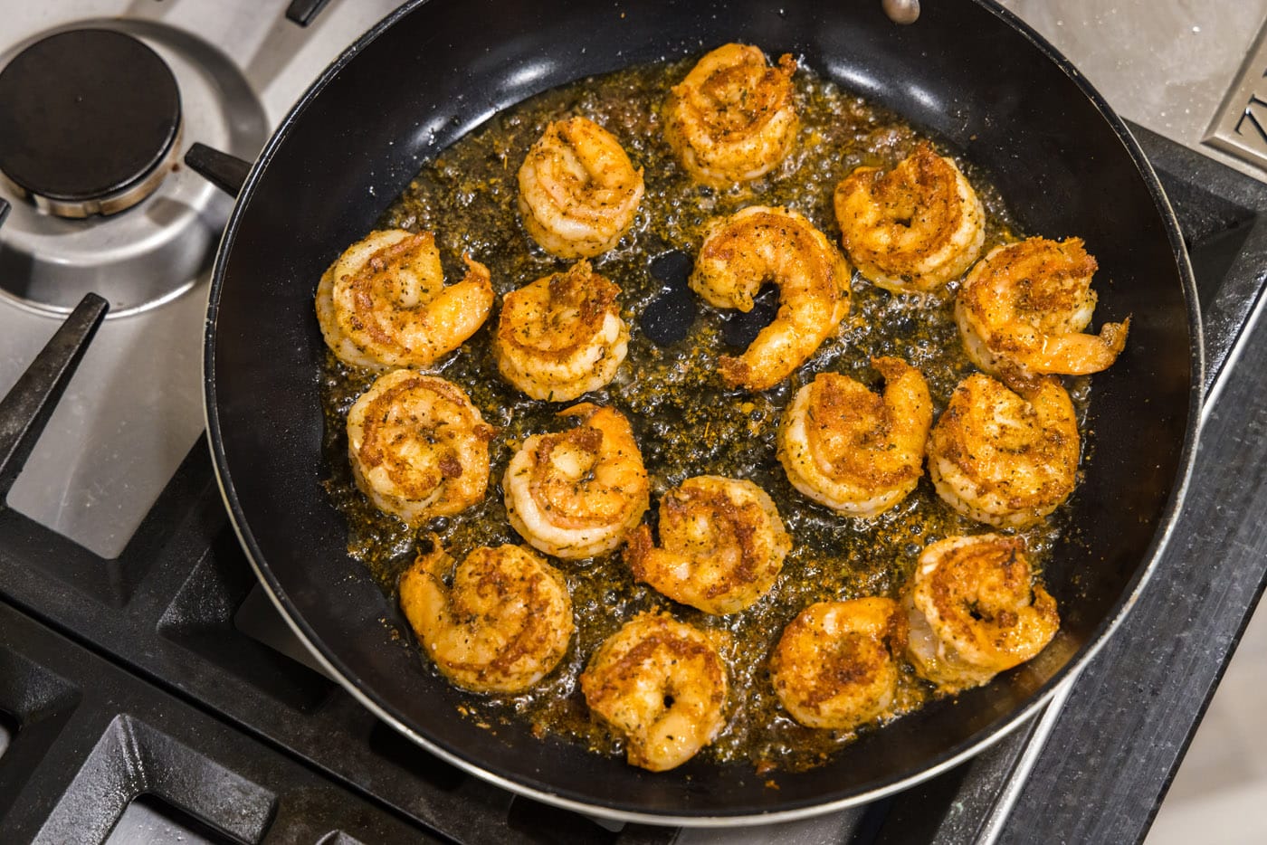 cooked cajun shrimp in a skillet