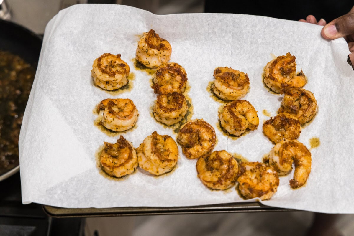 seasoned cooked shrimp on a paper towel