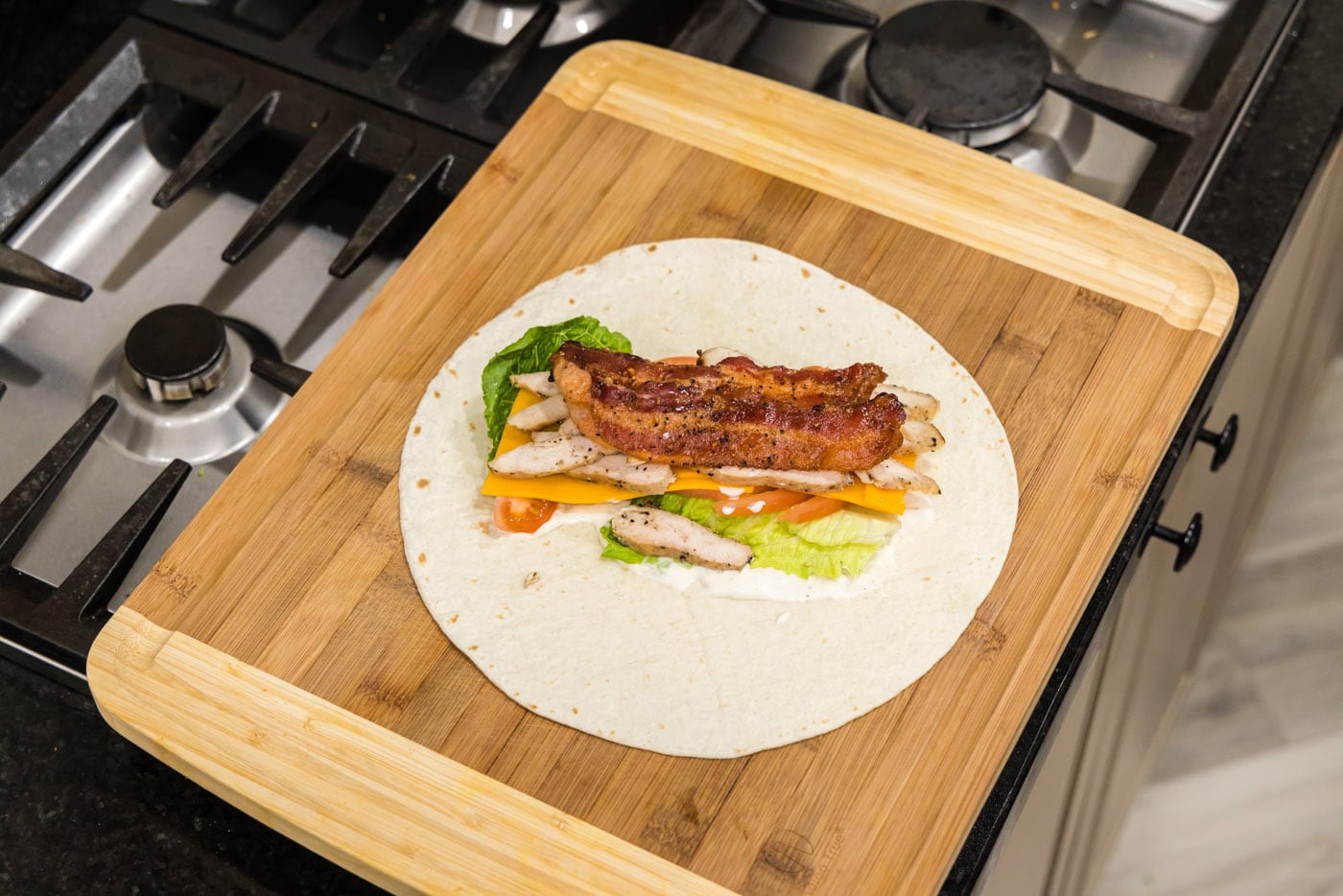chicken bacon ranch wrap on a cutting board