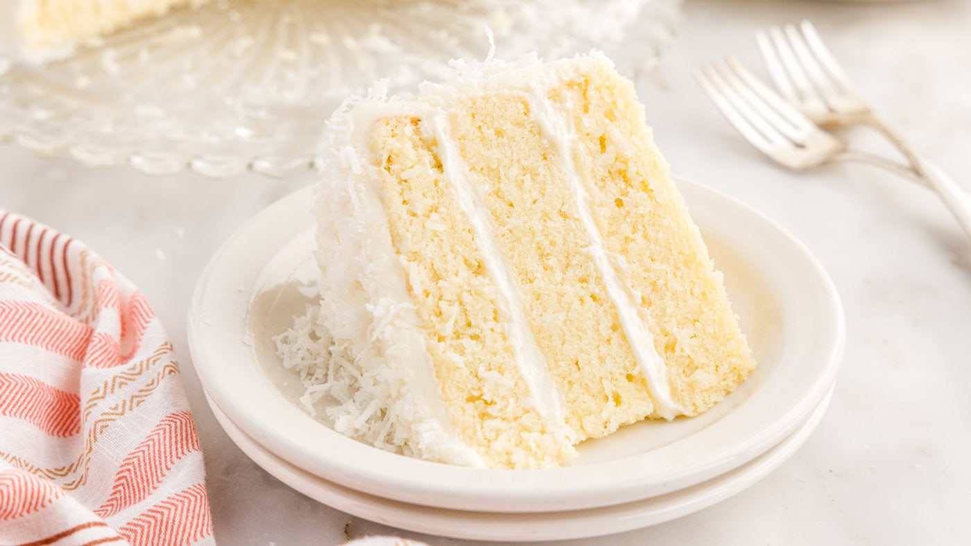 Coconut cake is soft, moist, and delicate with a chewy crumb while the cream cheese frosting adds ta