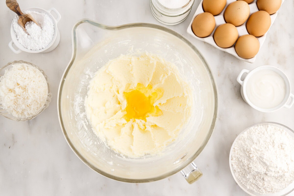 eggs added to butter and sugar beaten in a bowl