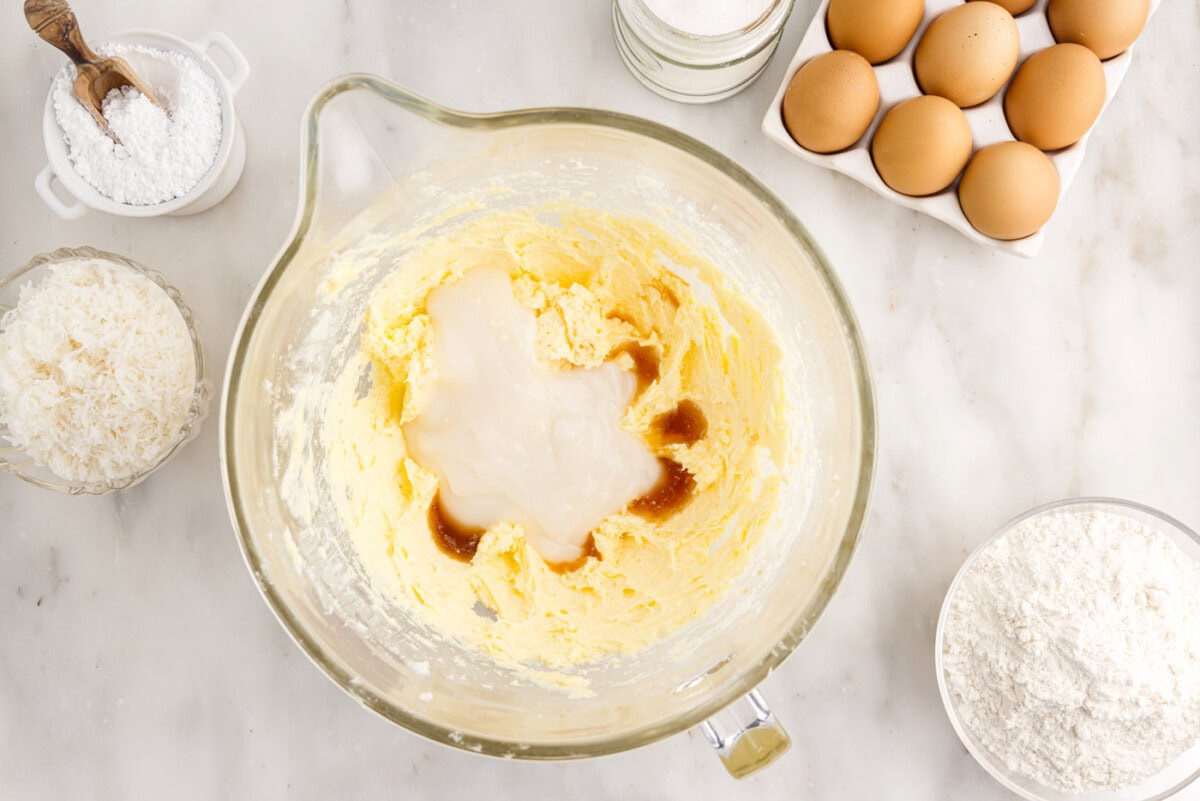 adding cream of coconut and extracts to cake batter
