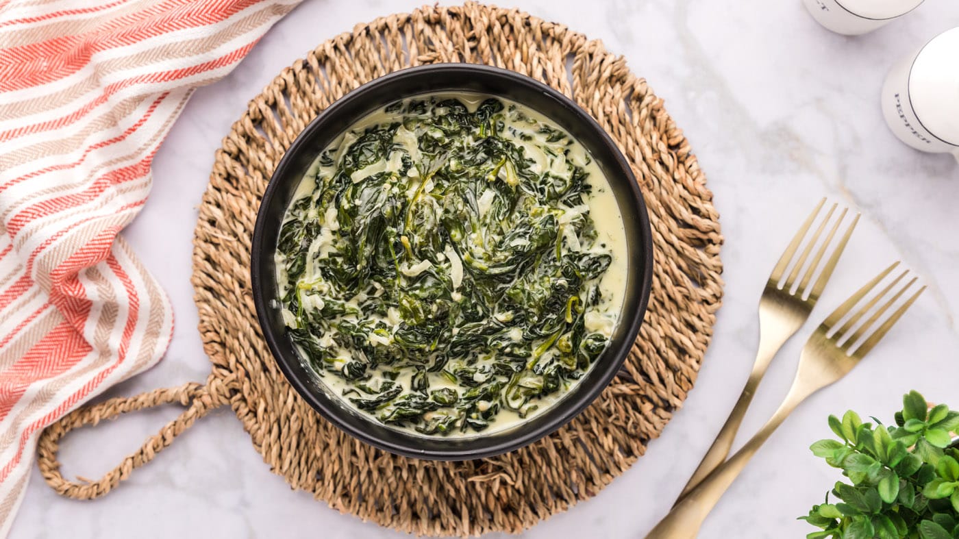 The rich and creamy sauce elevates fresh spinach leaves into a tender masterpiece when paired with s