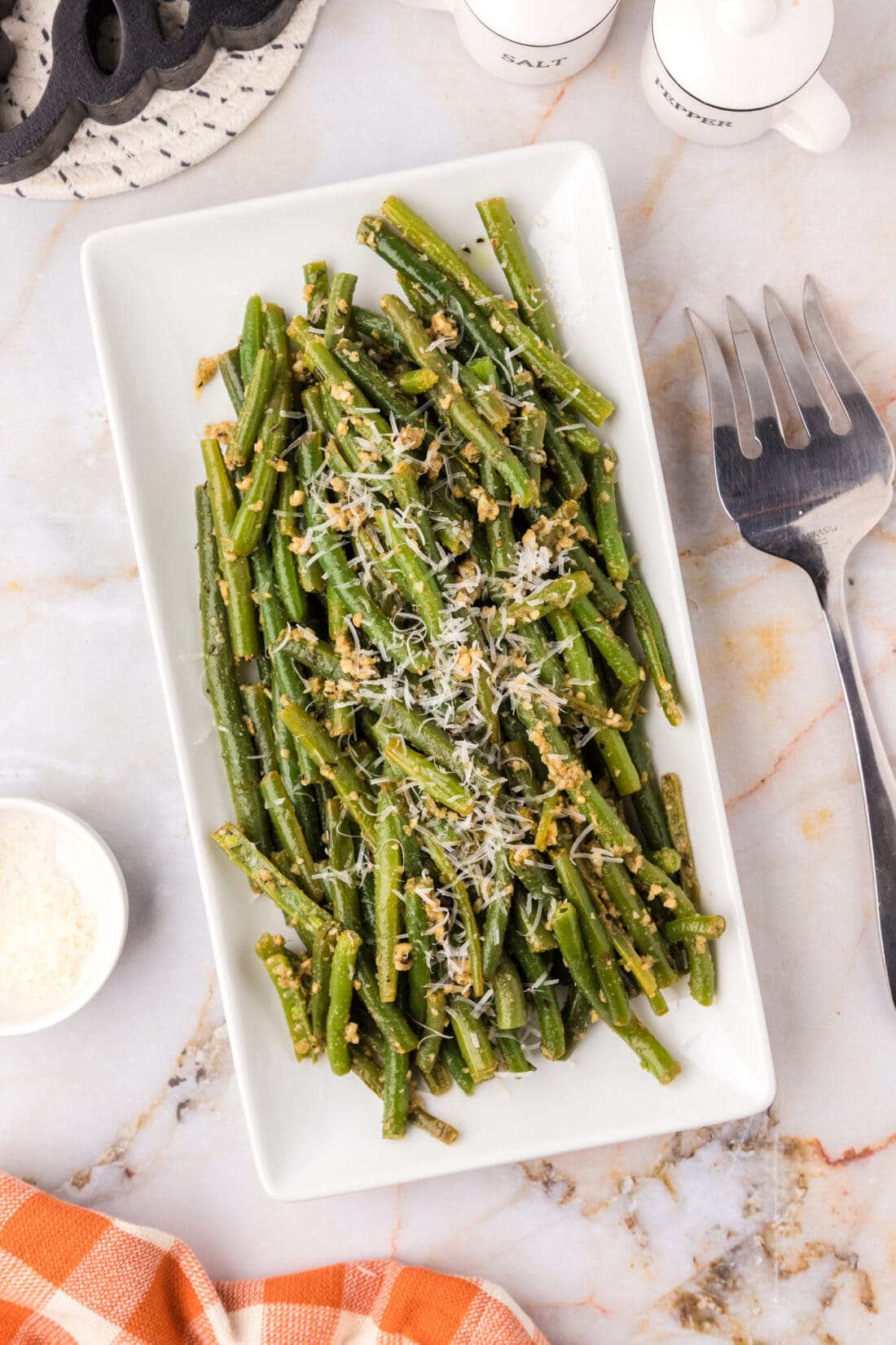 Garlic Green Beans on a platter garnished with parmesan