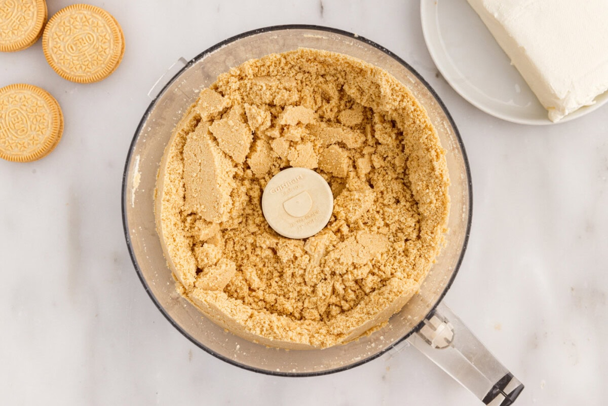 golden oreo cookie crumbs in a food processor