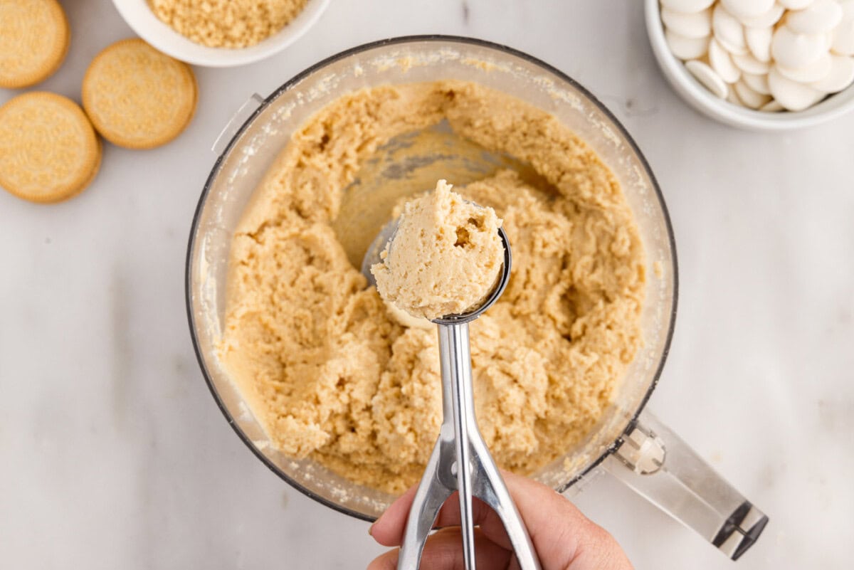 scooping dough from bowl