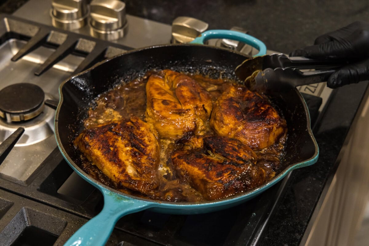 honey garlic chicken breasts in a skillet