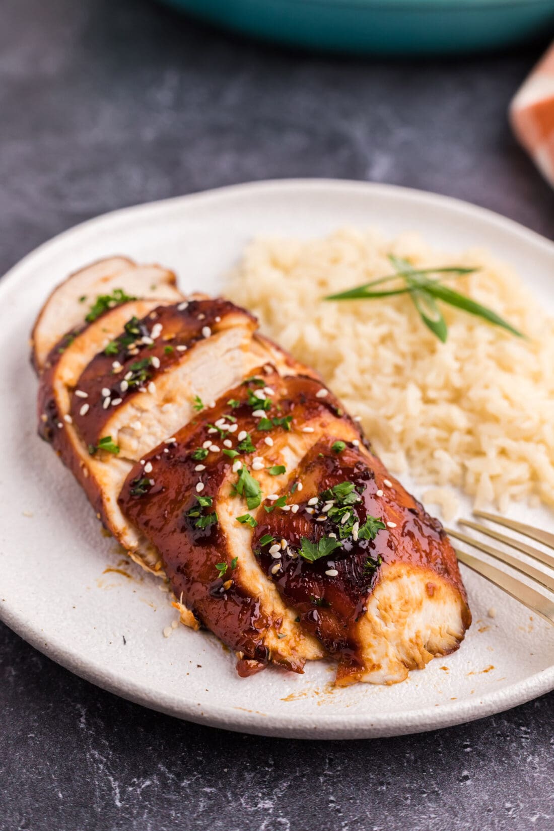 Sliced Honey Garlic Chicken Breast on a plate with rice