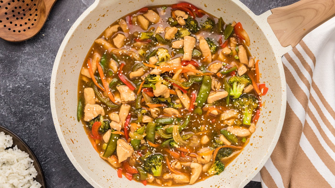 Honey garlic chicken stir fry is a combination of cubed chicken, carrots, bell peppers, broccoli, on