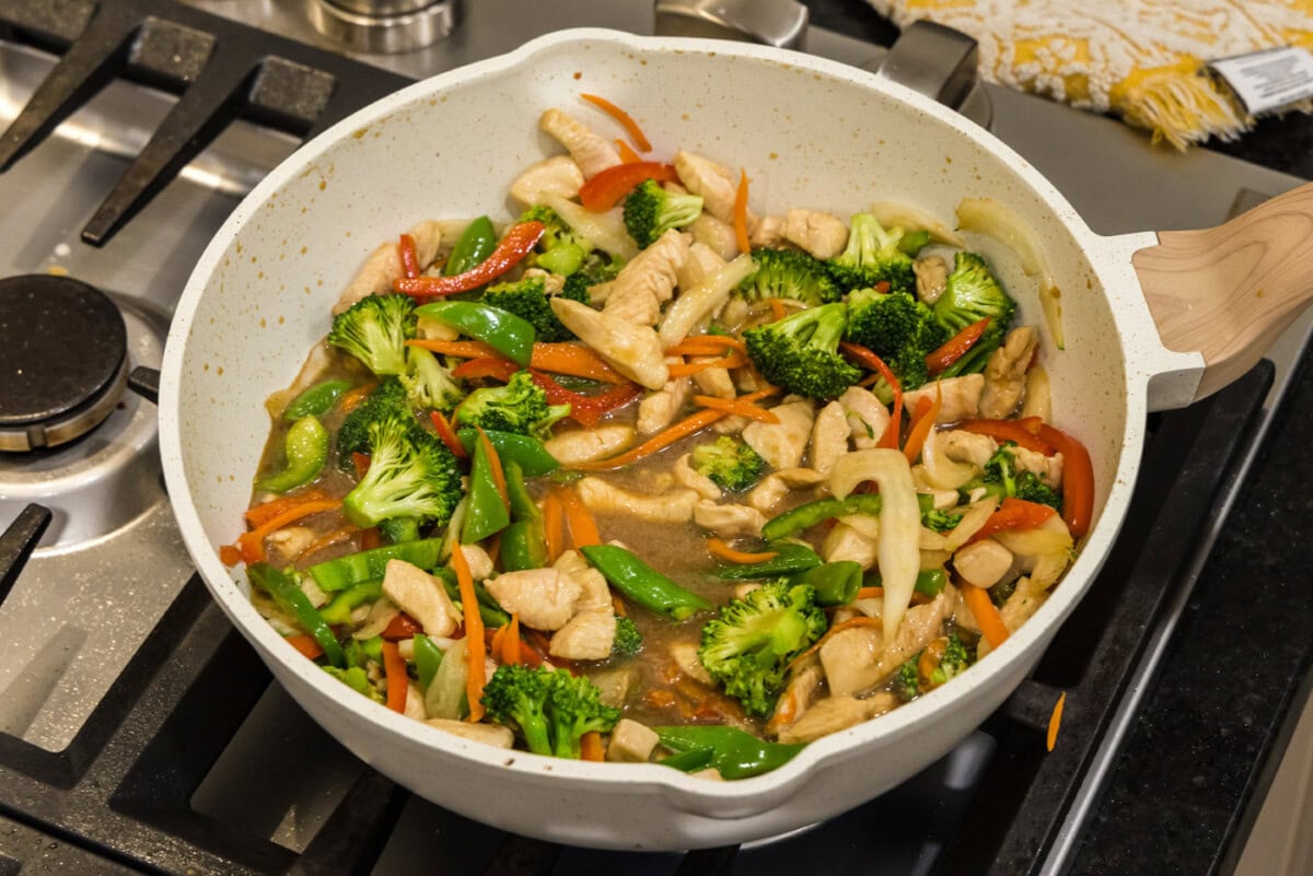 stir fried honey garlic chicken in a skillet