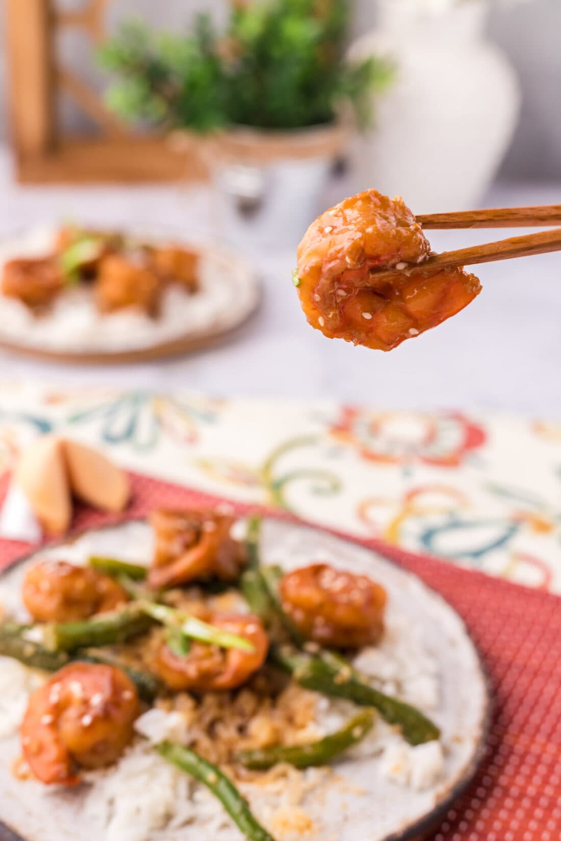 Chopsticks holding a Hunan Shrimp